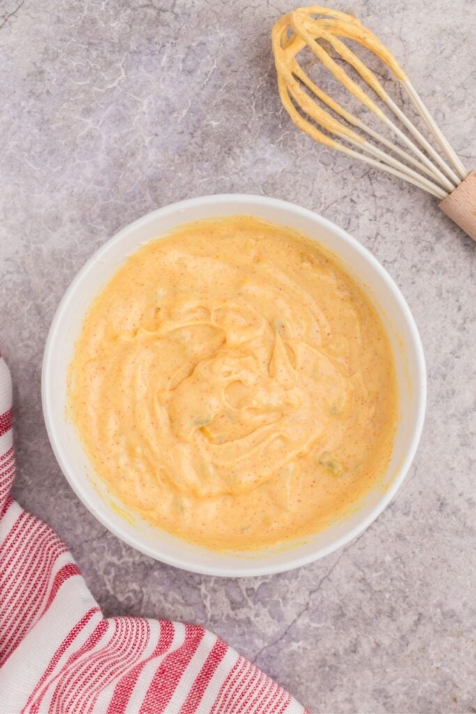 mixing all of the ingredients in a bowl