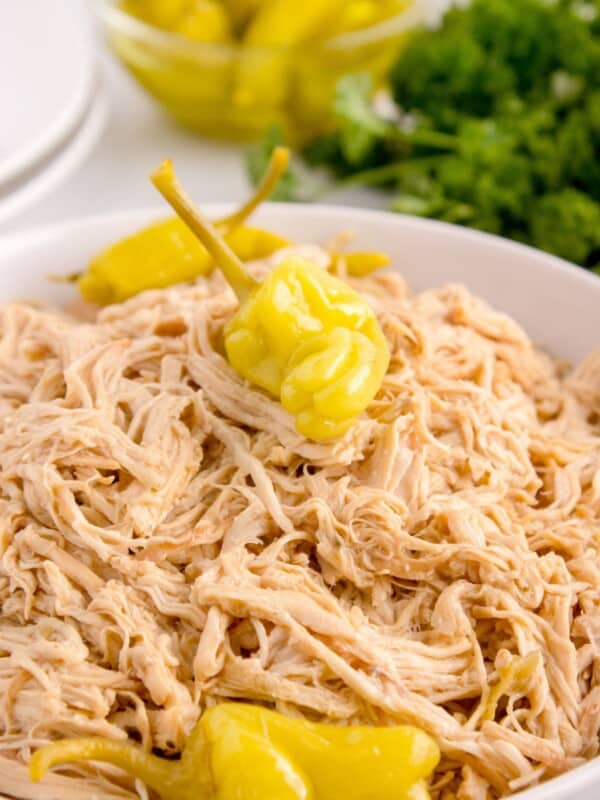 Mississippi chicken in a bowl with pepperoncini peppers