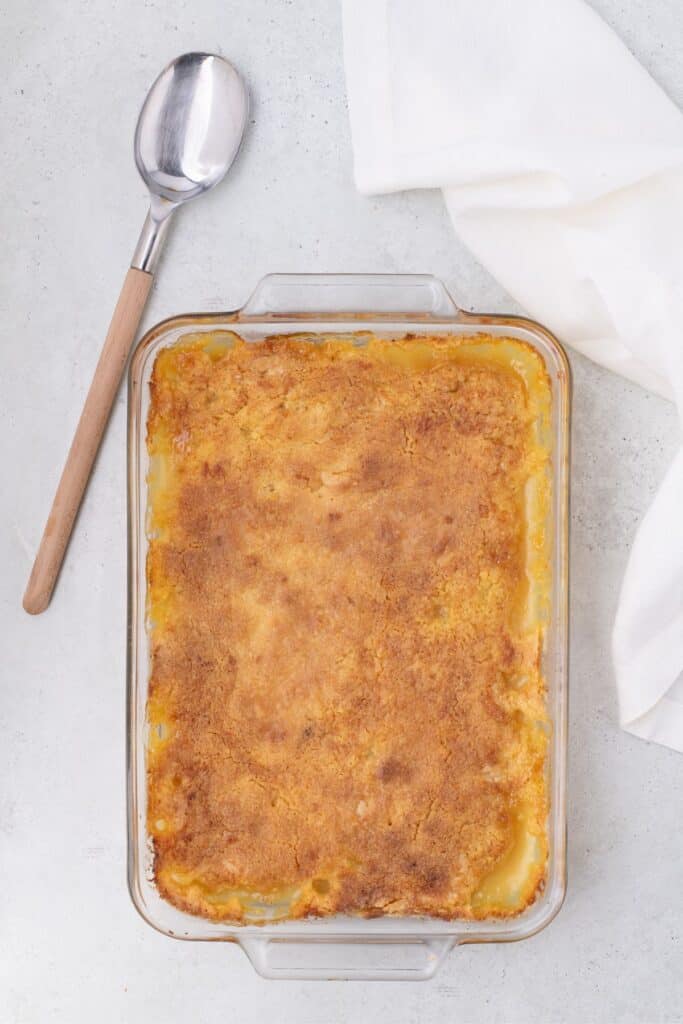 Pineapple Dump Cake baked in a glass pan.