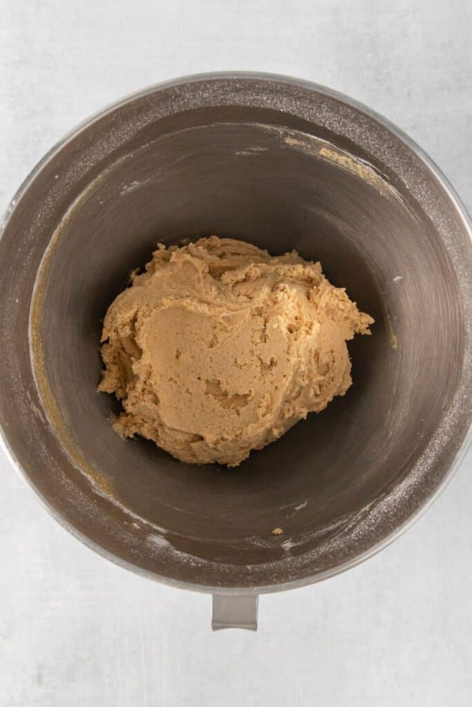 Peanut butter blossom cookies dough in a mixing bowl.
