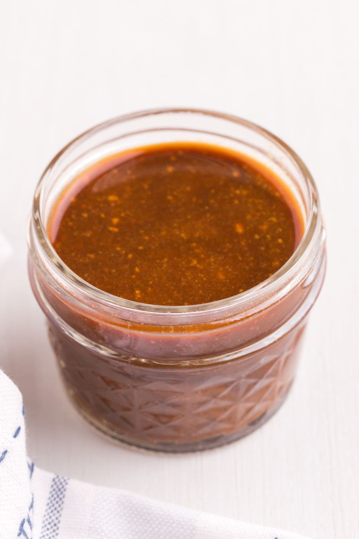 Closeup of a jar of steak marinade.