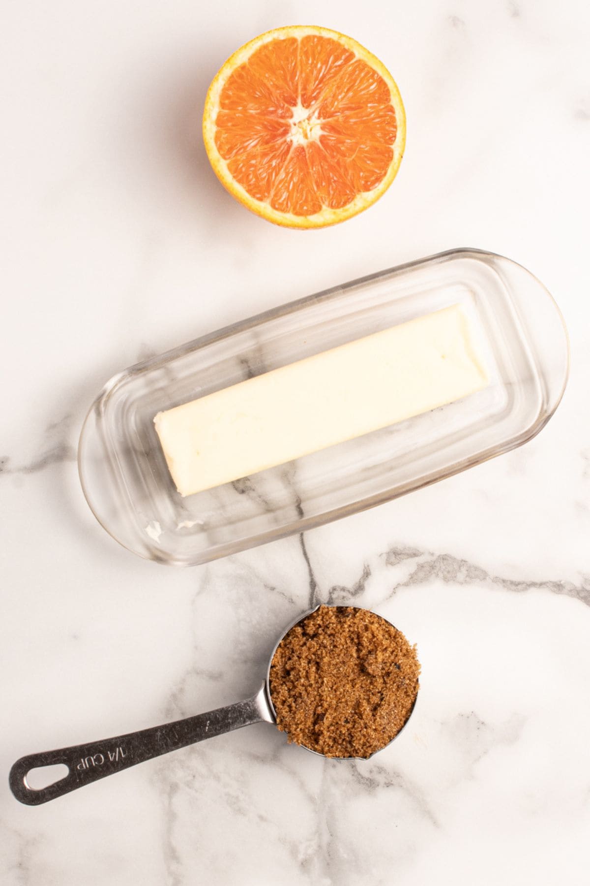 Ingredients needed to make this ham glaze recipe: butter, brown sugar, and orange juice.