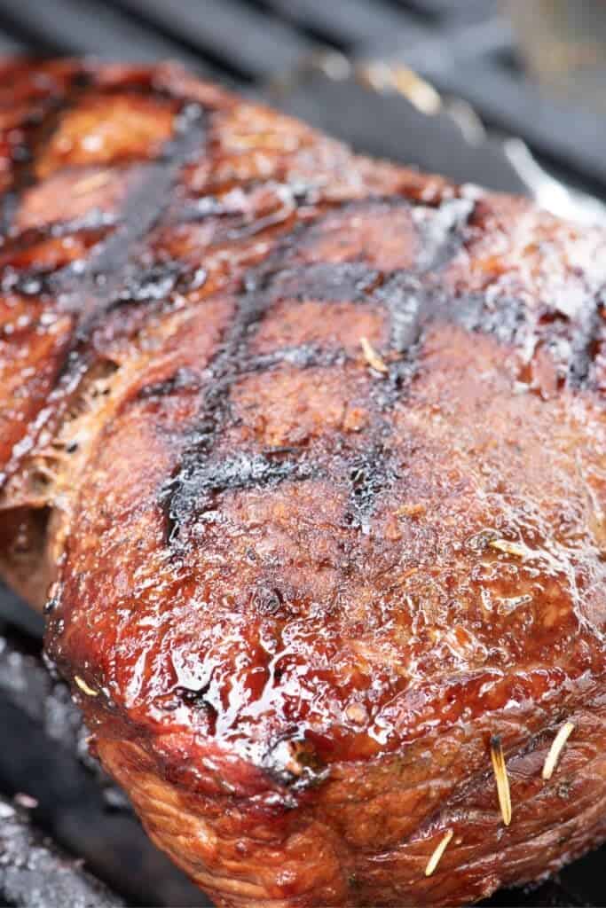 Close up view of London broil on the grill.