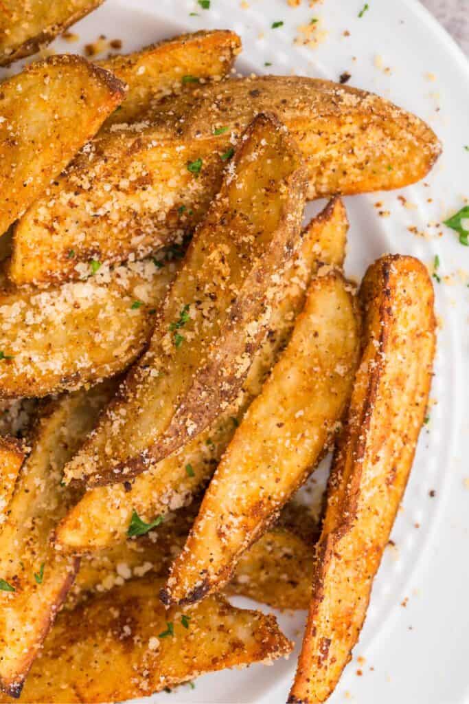 Air fryer potato wedges on a plate.