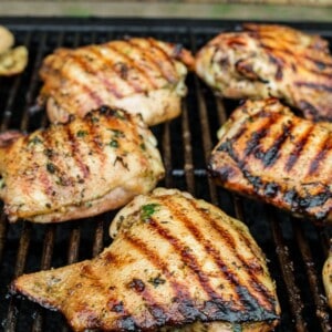 Chicken cooking on a grill.