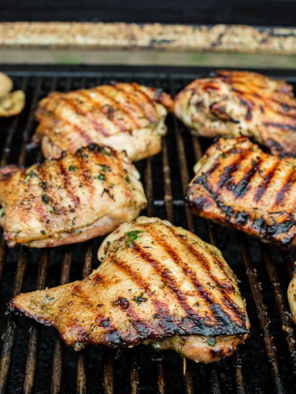 Chicken cooking on a grill.