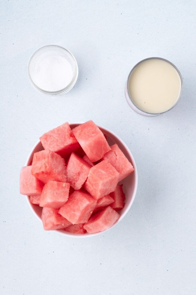 Ingredients for watermelon ice cream: watermelon, condensed milk, and salt.