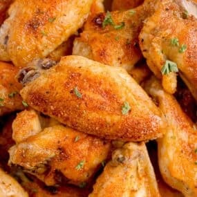 Pile of baked chicken wings.