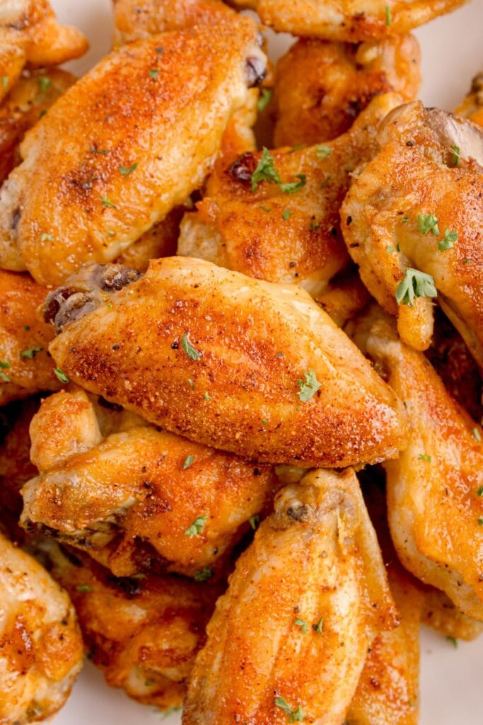 Pile of baked chicken wings.