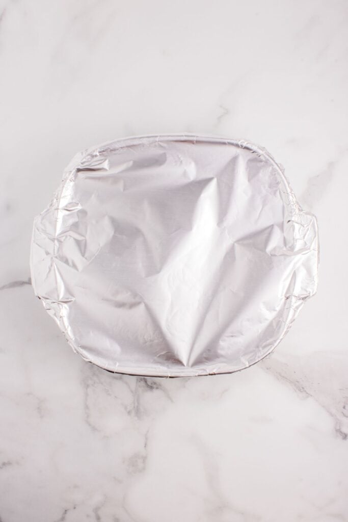 Baking dish covered with aluminum foil.