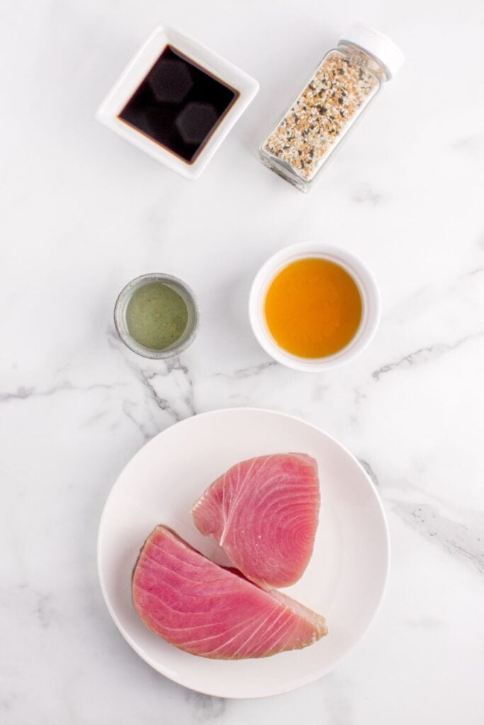 Ingredients for tuna steak recipe: ahi tuna steaks, soy sauce, toasted sesame oil, Everything bagel seasoning, and olive oil.