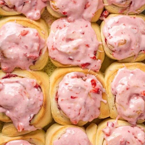 Strawberry rolls glazed and all in a row.
