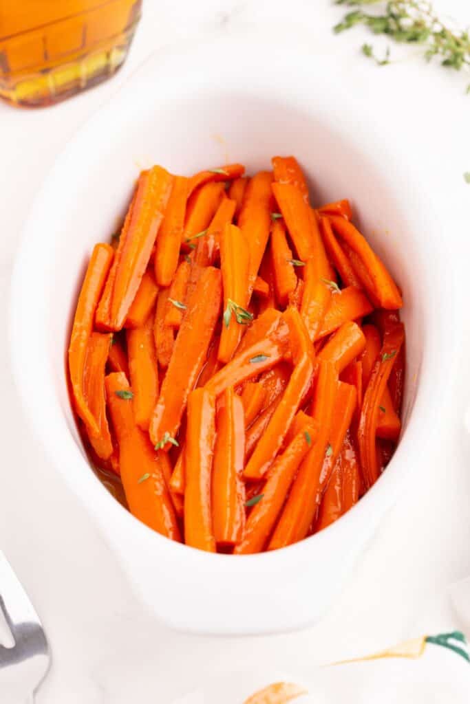 Completed carrots in a white serving plate.