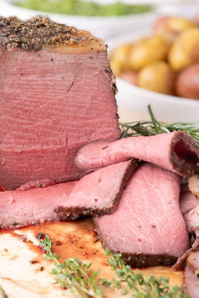 Bottom round roast sliced to show interior of beef.
