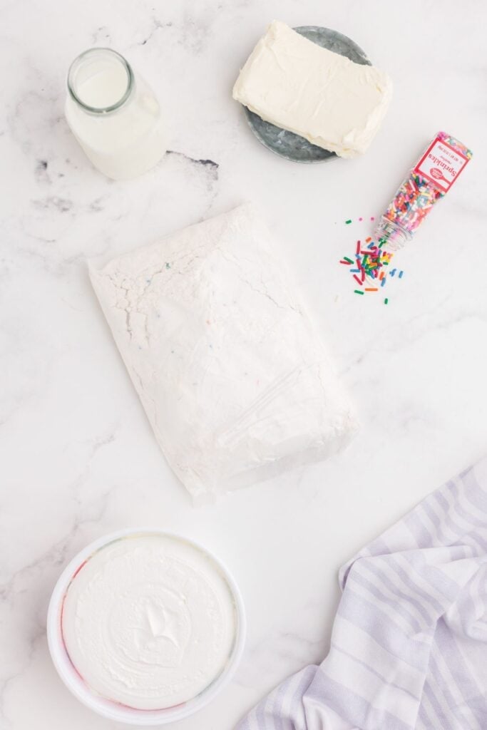 Ingredients for Funfetti Dip: Funfetti Cake mix, cream cheese, whipped cream, milk, and sprinkles.