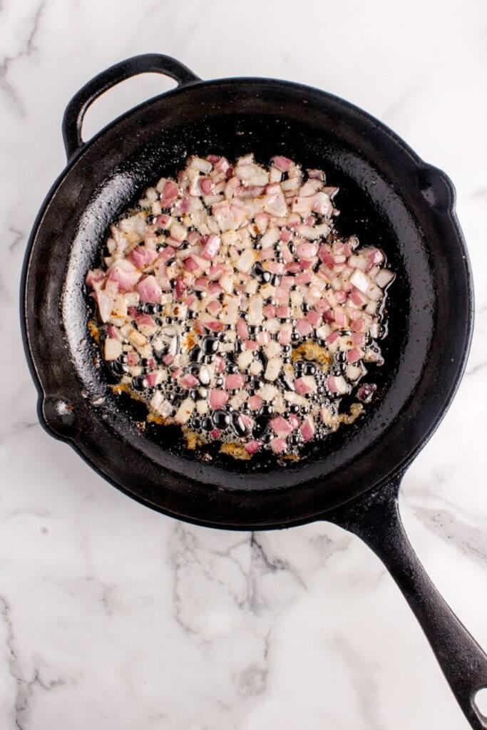 Diced onions frying in bacon grease.