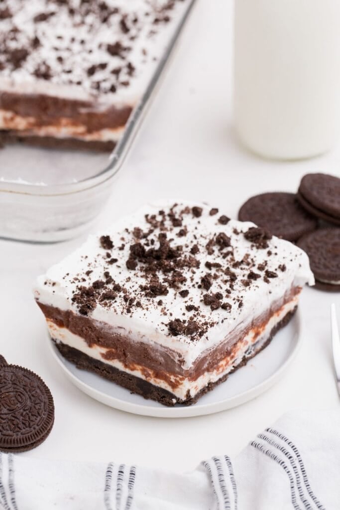 Slice of chocolate lasagna on a small white plate.