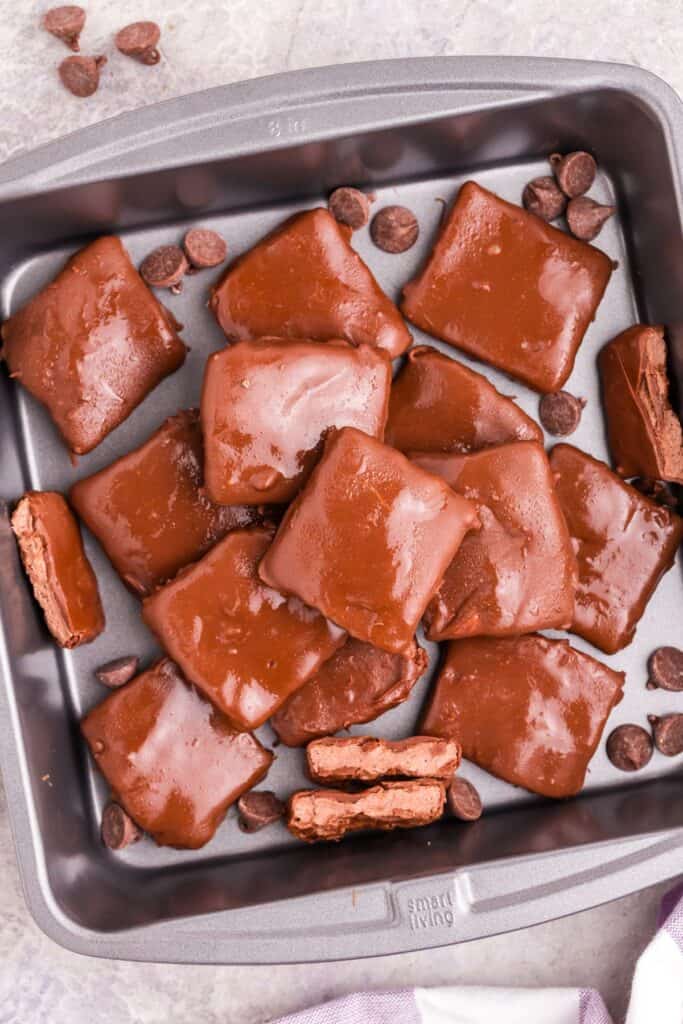 Finished Cool Whip candy is piled up in a square baking pan.
