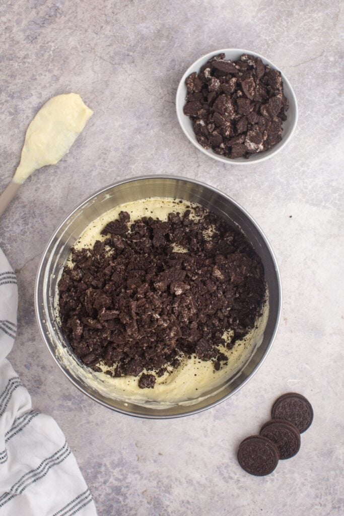 Crushed Oreos are added to the vanilla pudding and Cool Whip mixture.
