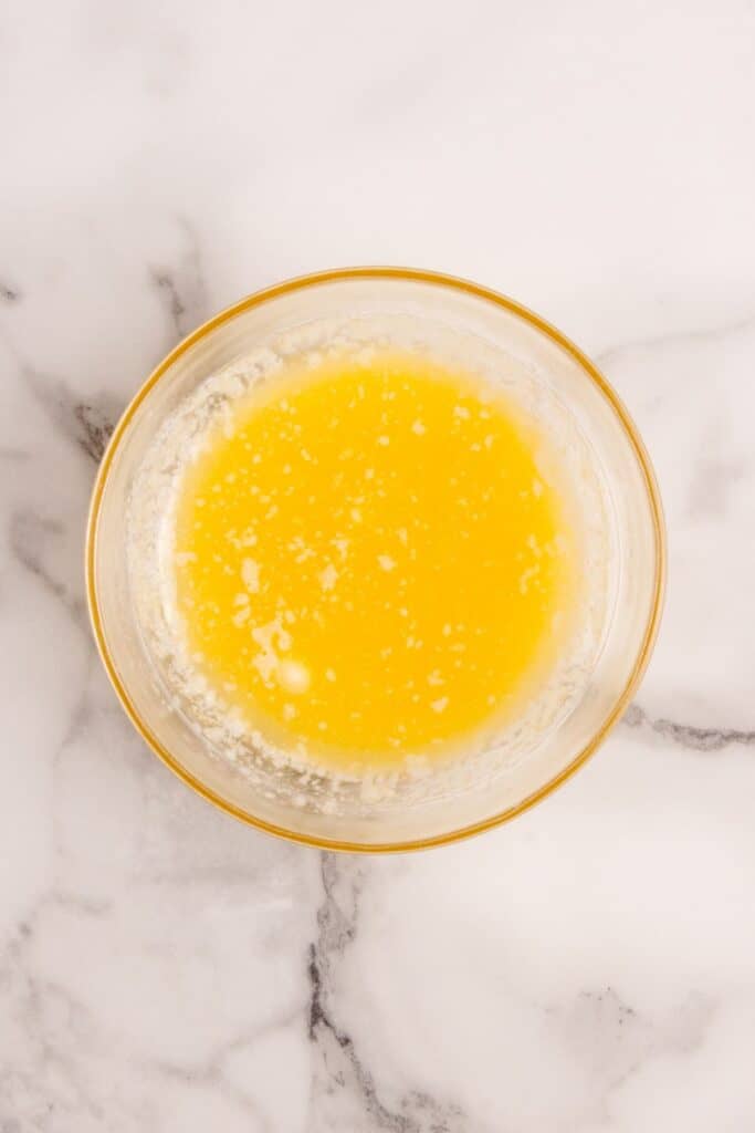 Melted butter in a glass bowl.