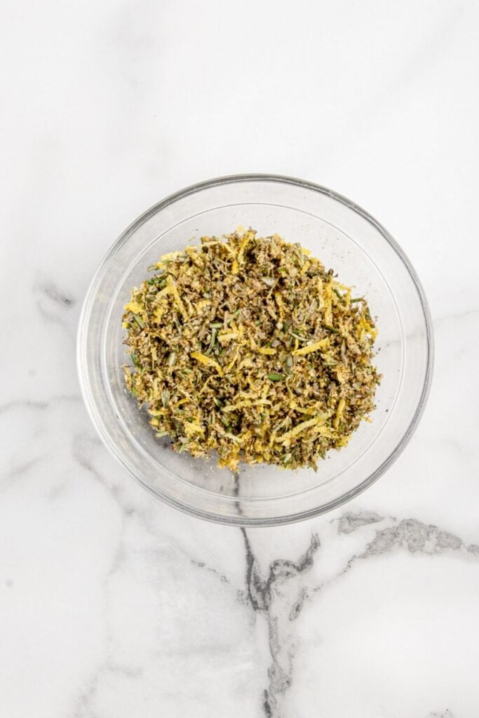 Glass bowl of seasoning mix for lamb roast.