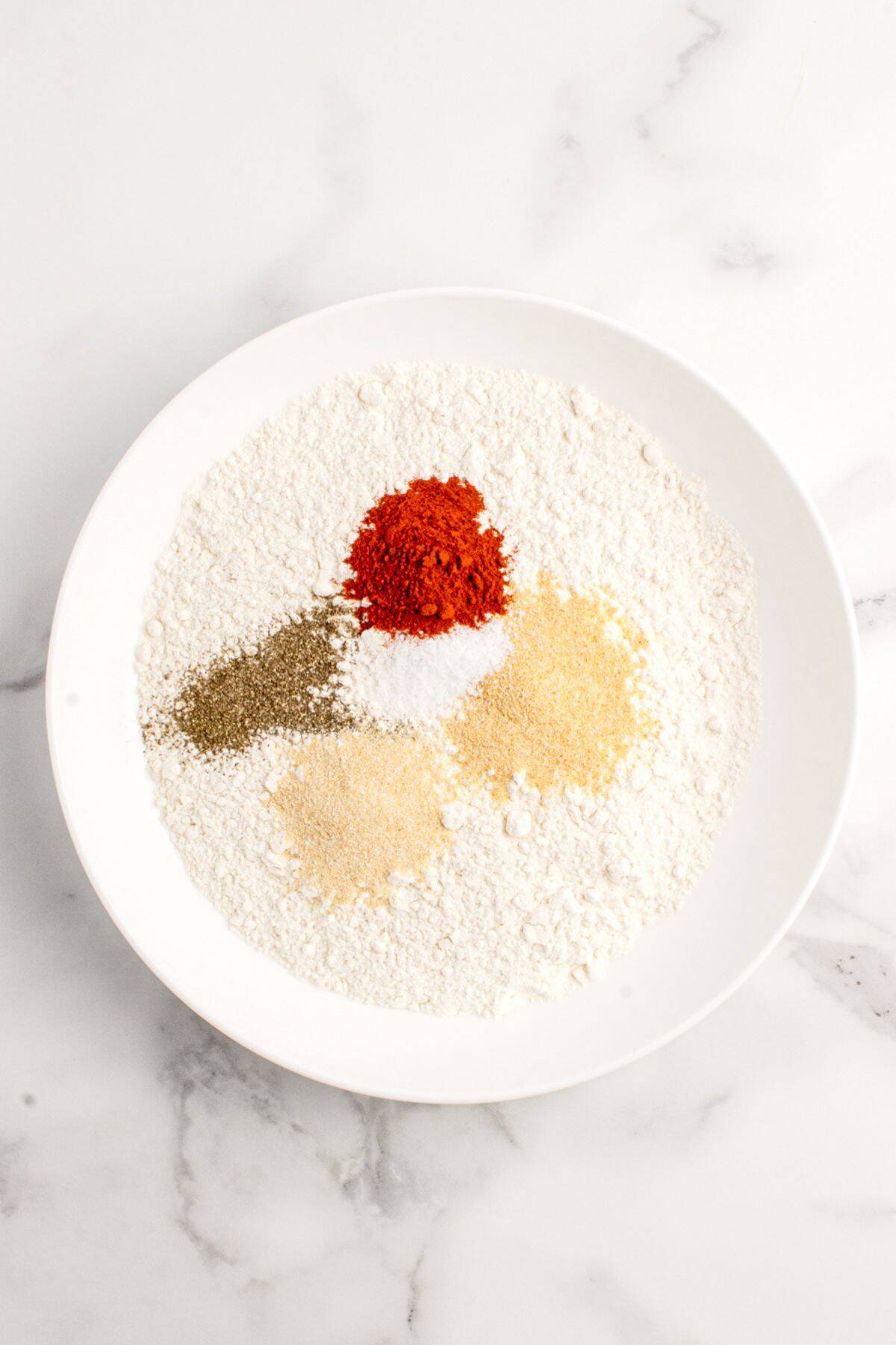 Dry flour mixture with flour, sweet paprika, garlic powder, onion powder, salt, and pepper.