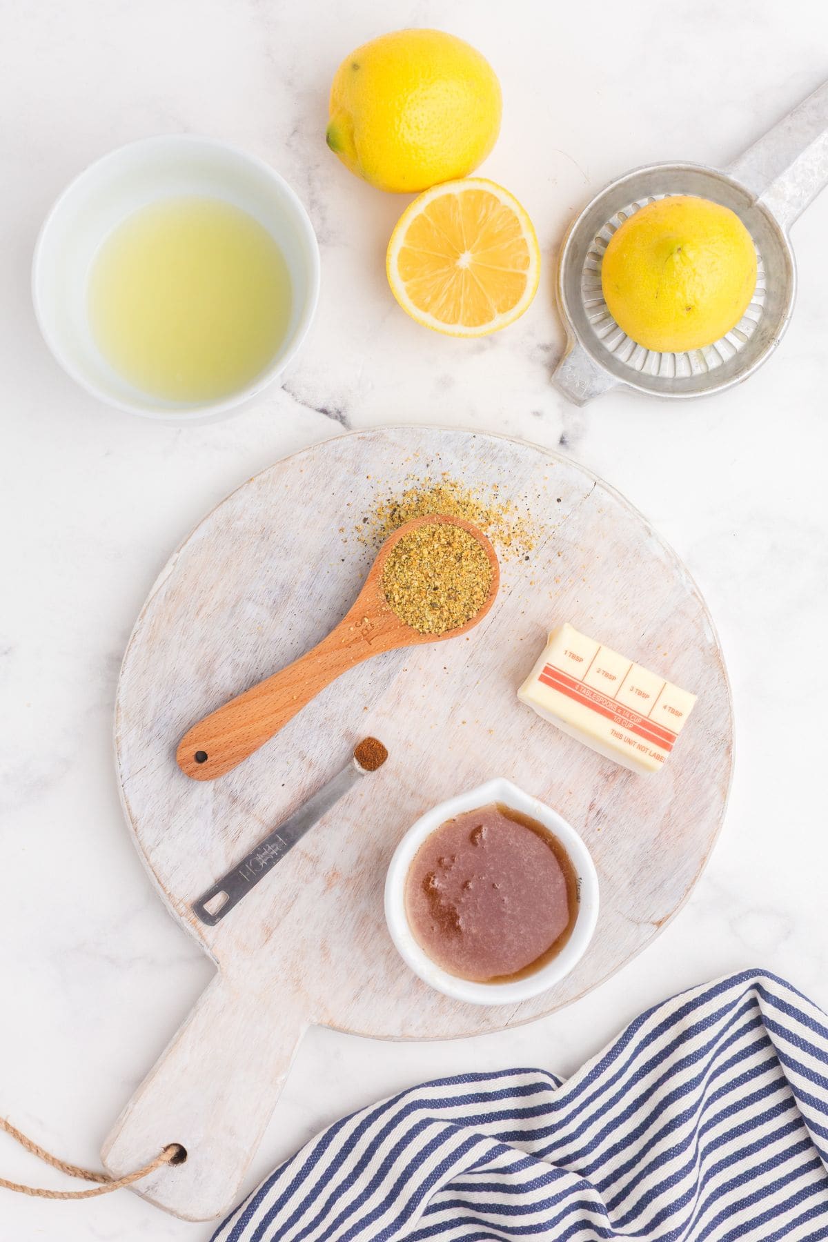 Ingredients for lemon pepper sauce: lemon juice, lemon pepper seasoning, honey, butter, cayenne pepper.