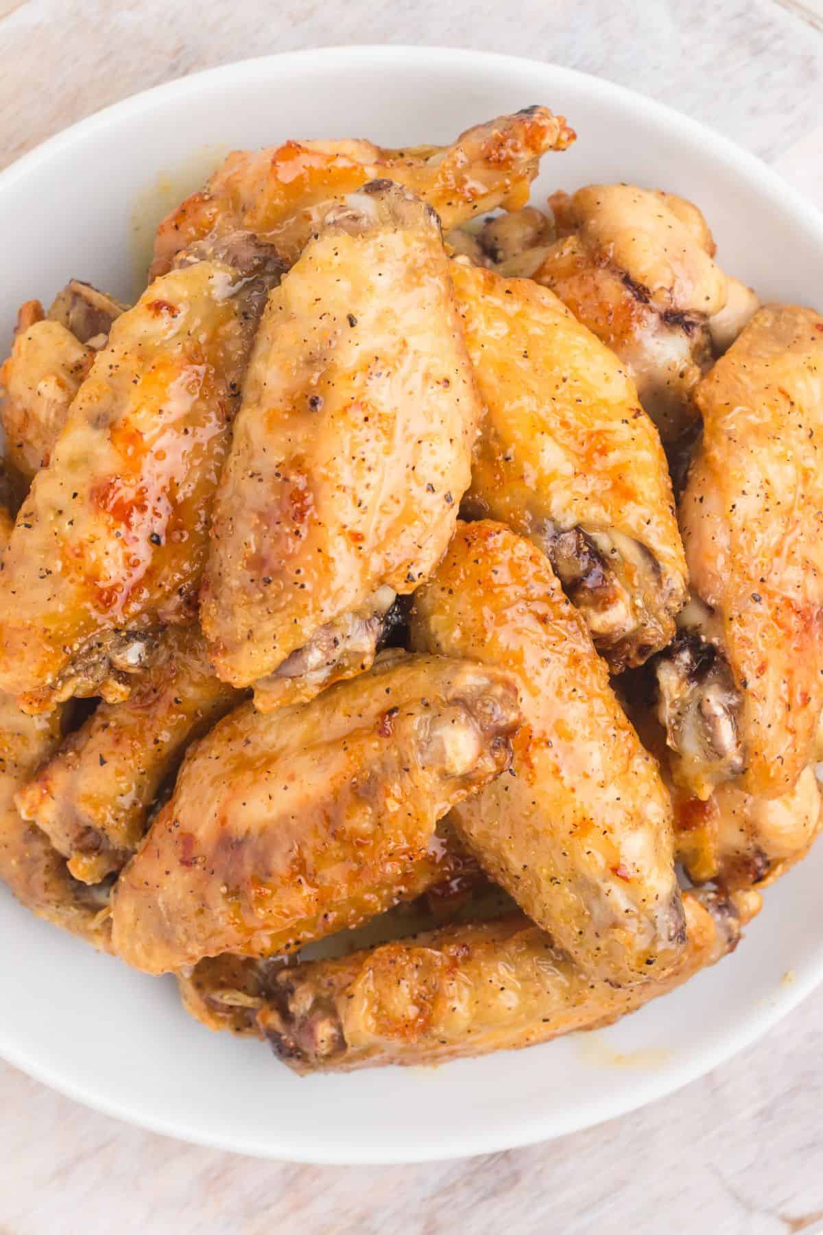 Lemon pepper sauce on chicken wings.