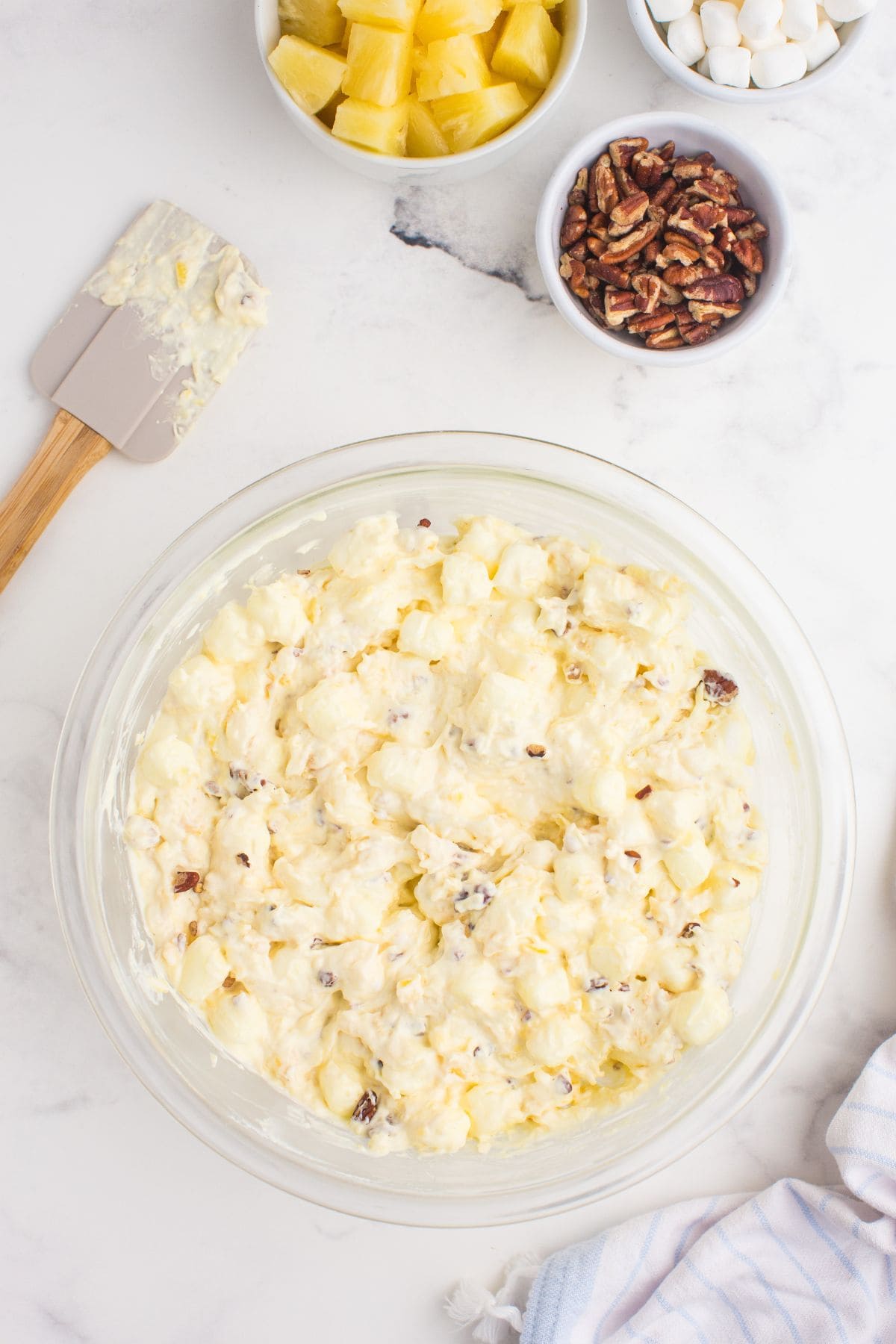 Completed pineapple fluff in a glass mixing bowl.