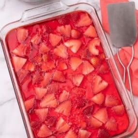 Chilled strawberry salad in a glass baking dish.