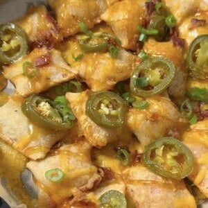 air fryer loaded pizza bites in an air fryer basket.