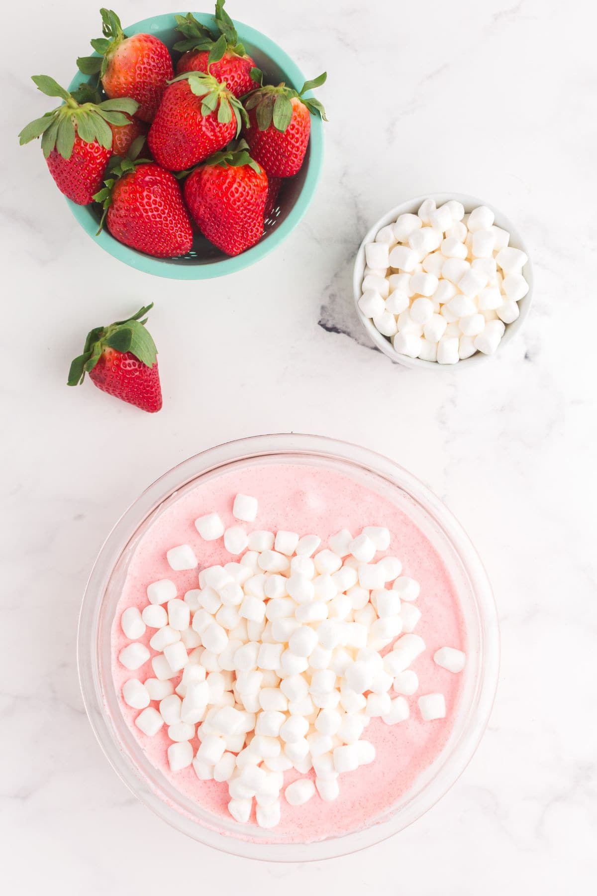 Mini marshmallows added to the strawberry fluff mixture.