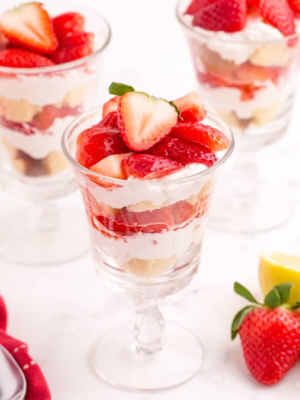 Completed strawberry parfait in three tall glasses.