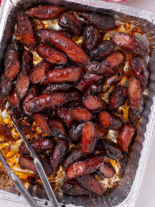 Hot dog burnt ends in a aluminum baking dish.