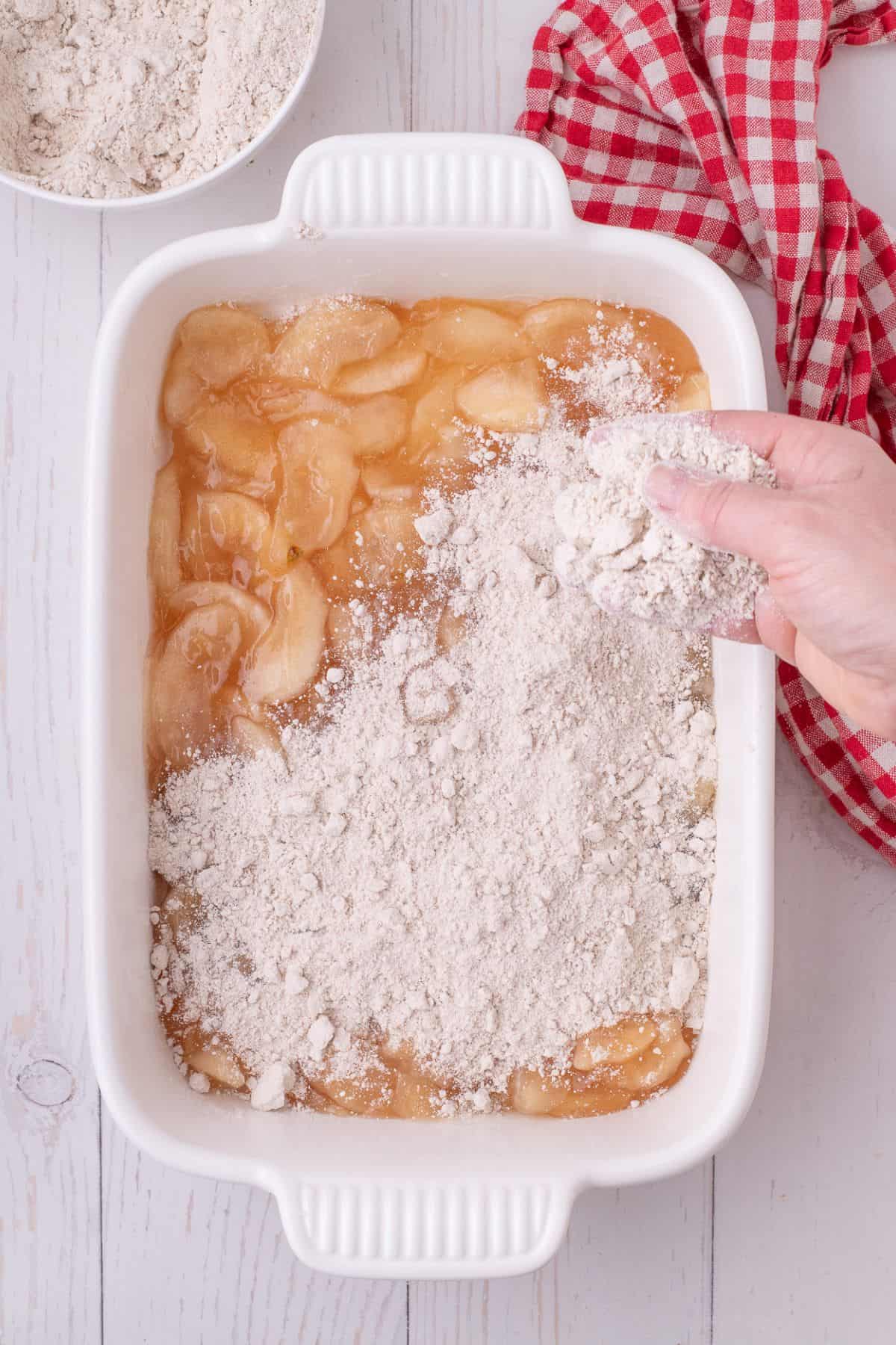 cake mix evenly spread over the top of the apple pie filling.