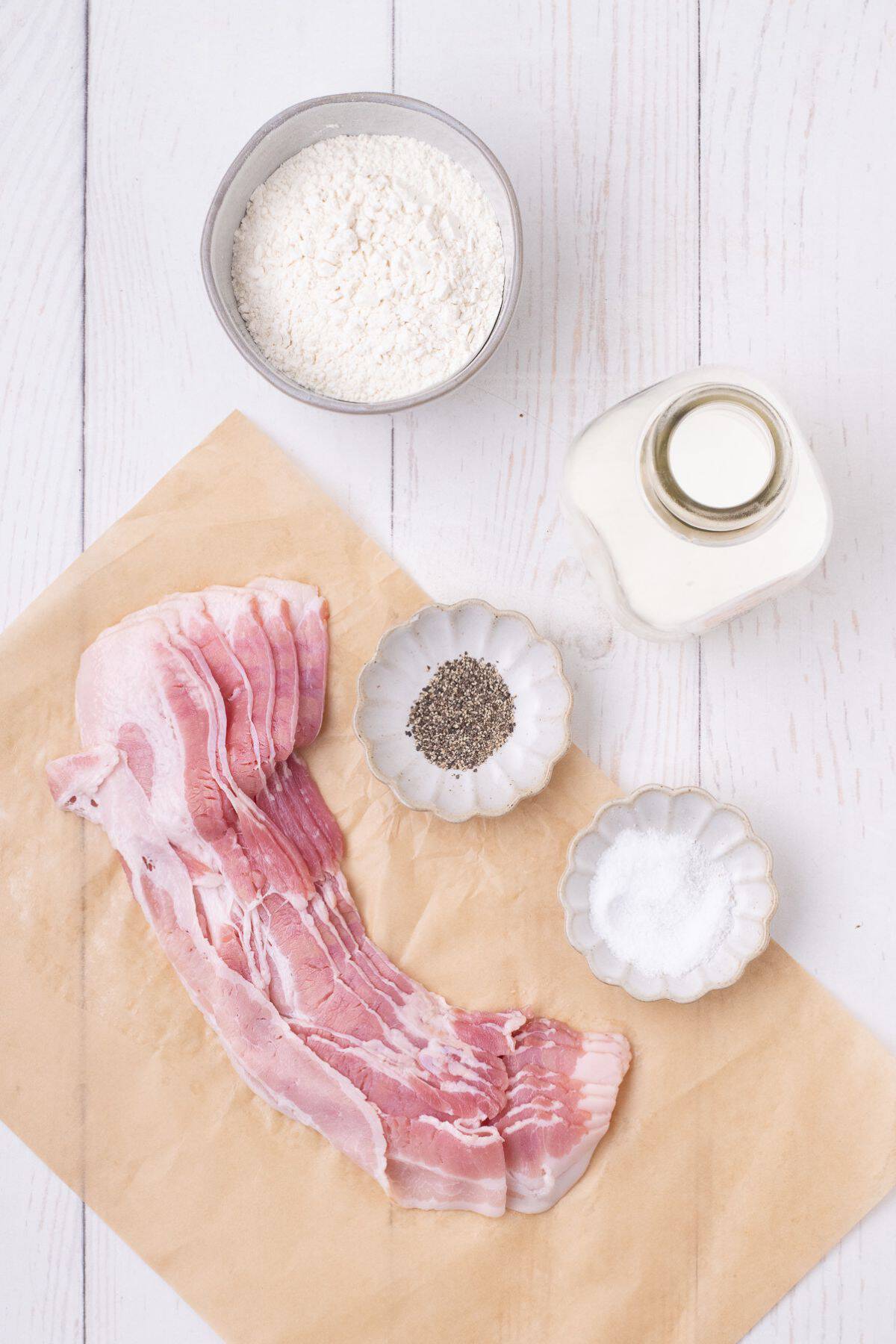 Ingredients for bacon gravy: bacon, salt, pepper, milk, and flour.