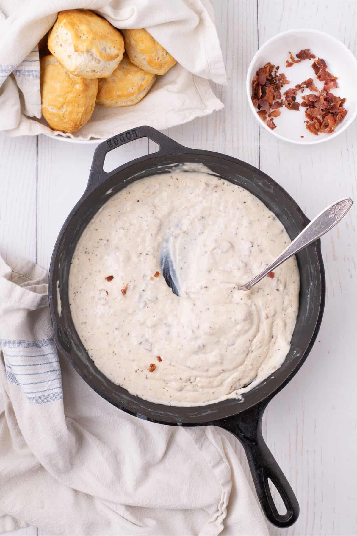 Completed bacon gravy in a cast iron skillet.