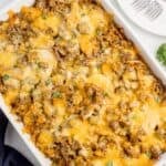 Completed Cheesy hamburger potato casserole in a white baking dish.