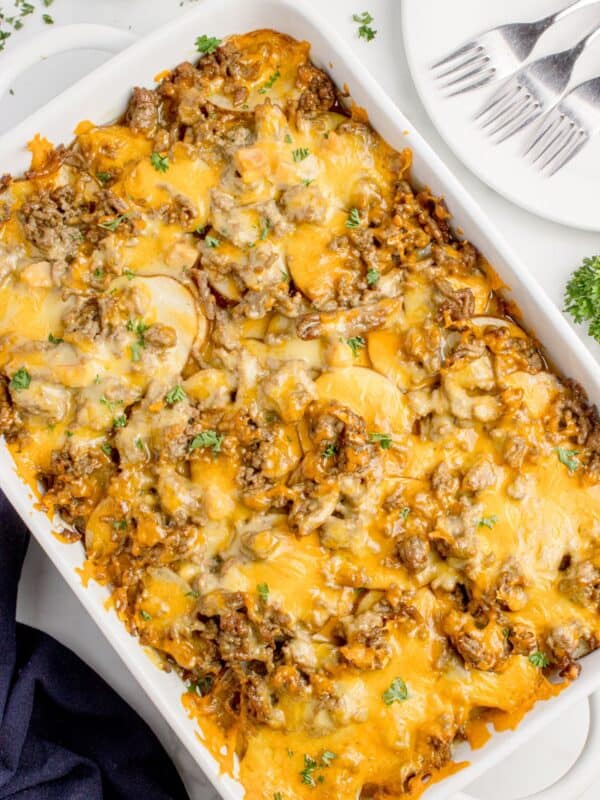 Completed Cheesy hamburger potato casserole in a white baking dish.