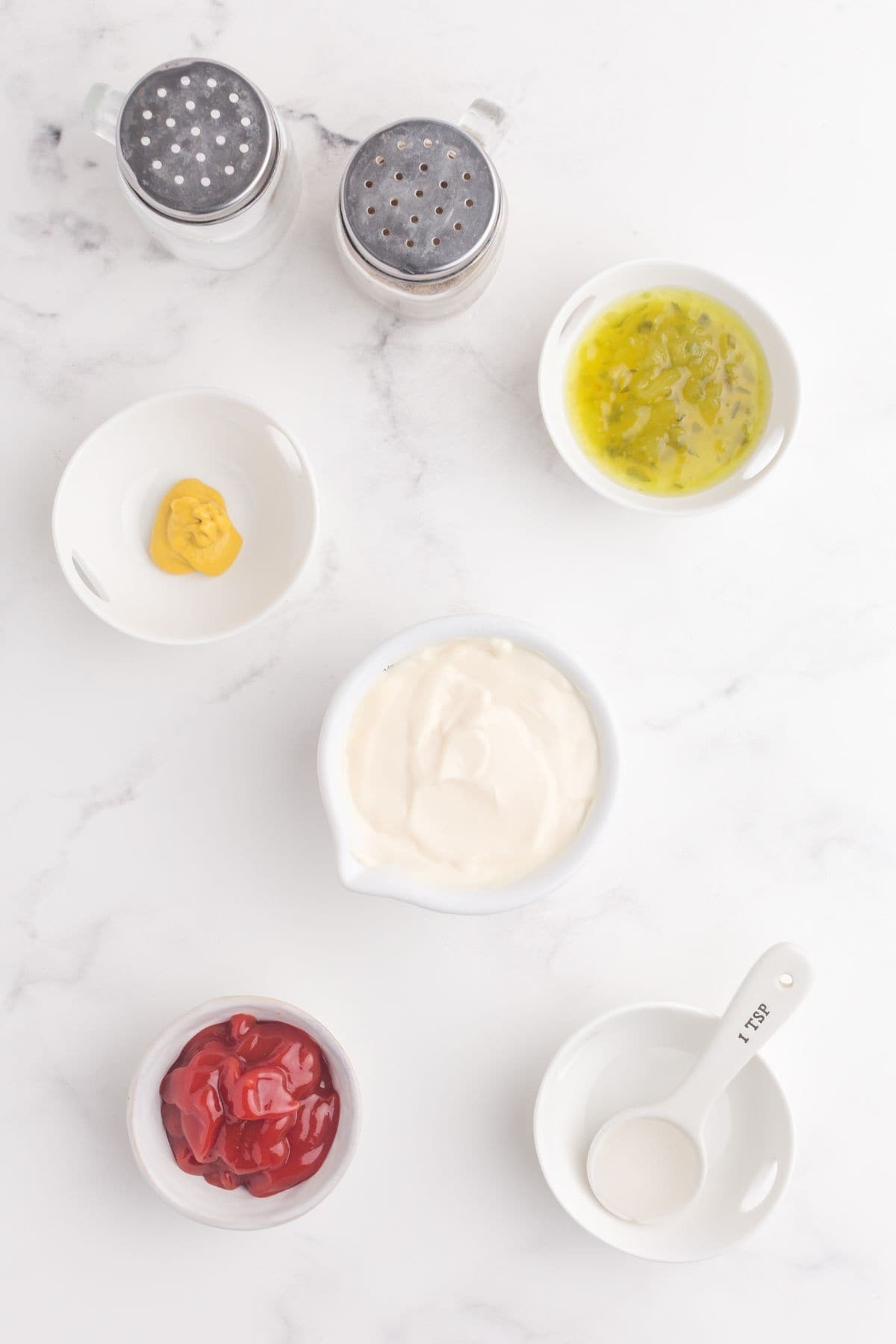 Ingredients for In-N-Out Sauce: mayonnaise, ketchup, yellow mustard, white vinegar, sweet pickle relish, salt, and pepper.