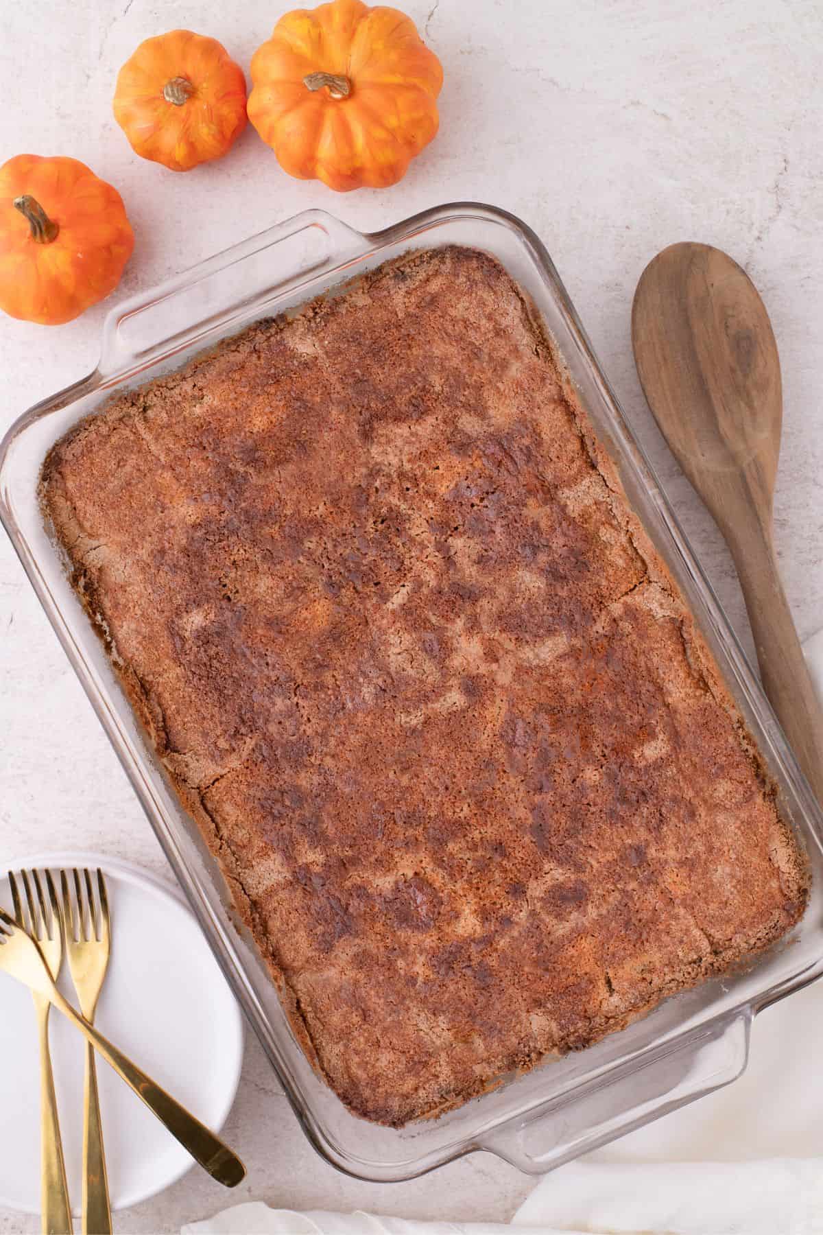Completed pumpkin dump cake in a glass baking pan.