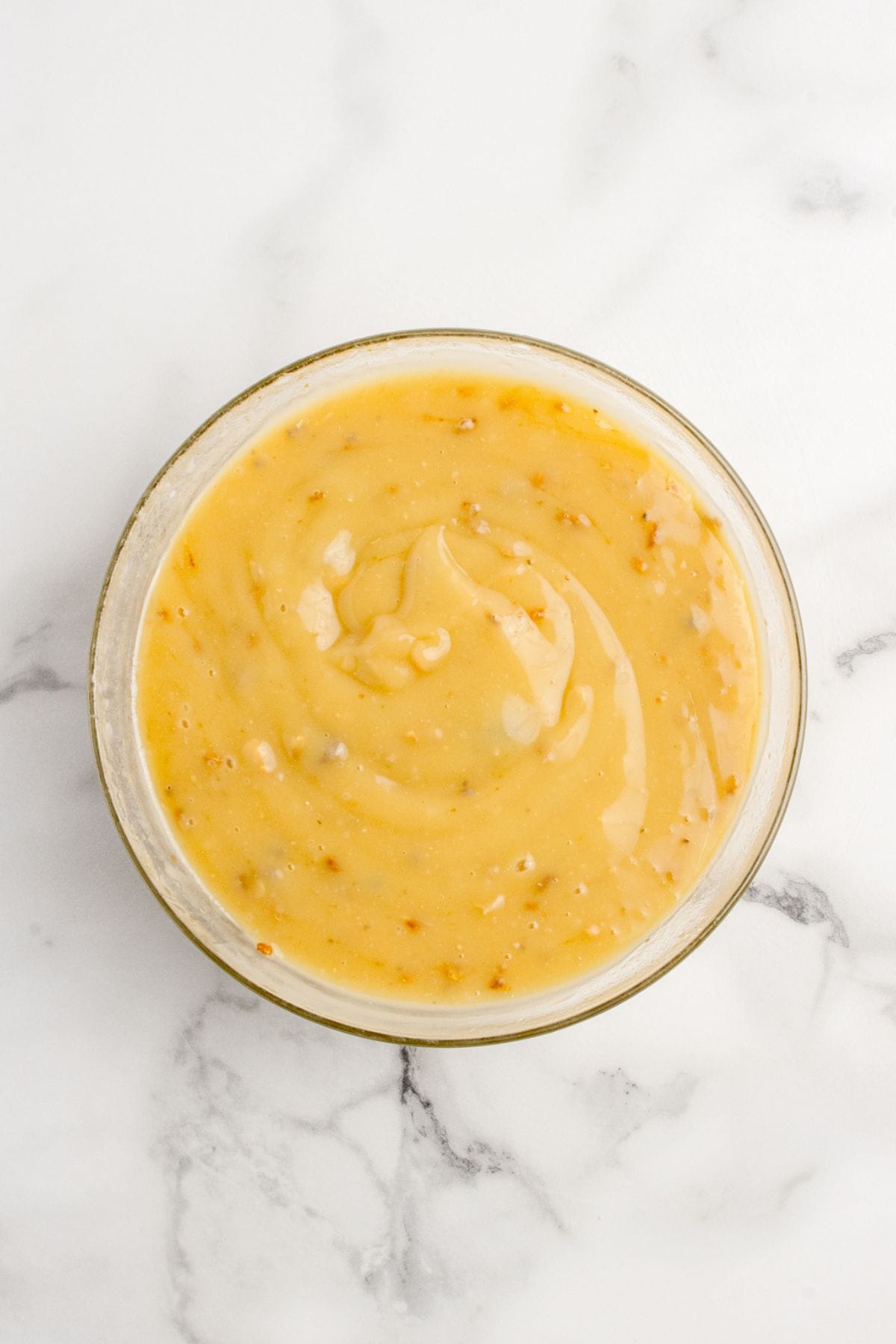 Gravy ingredients combined in a glass bowl.