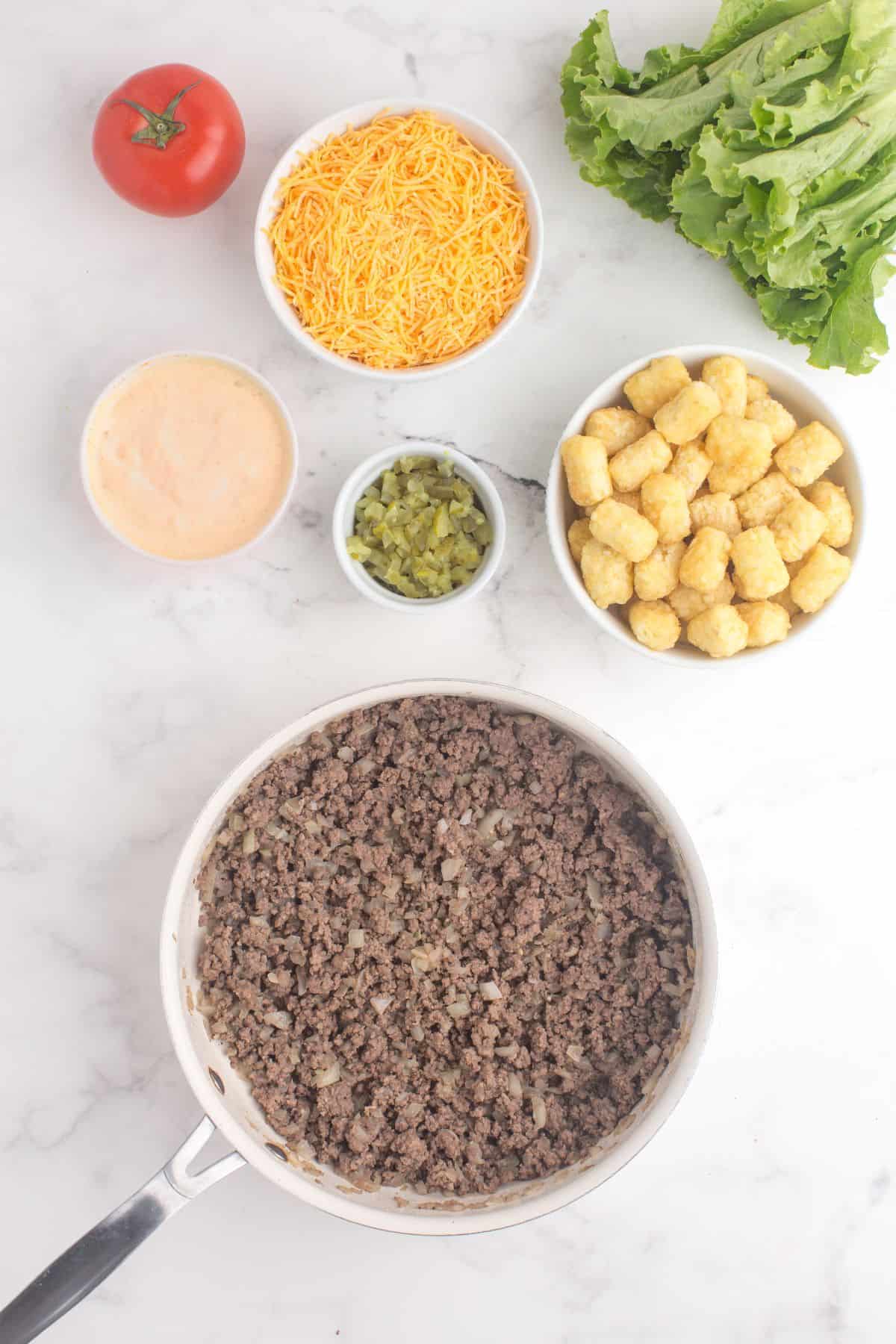 Cook ground beef and onions together.