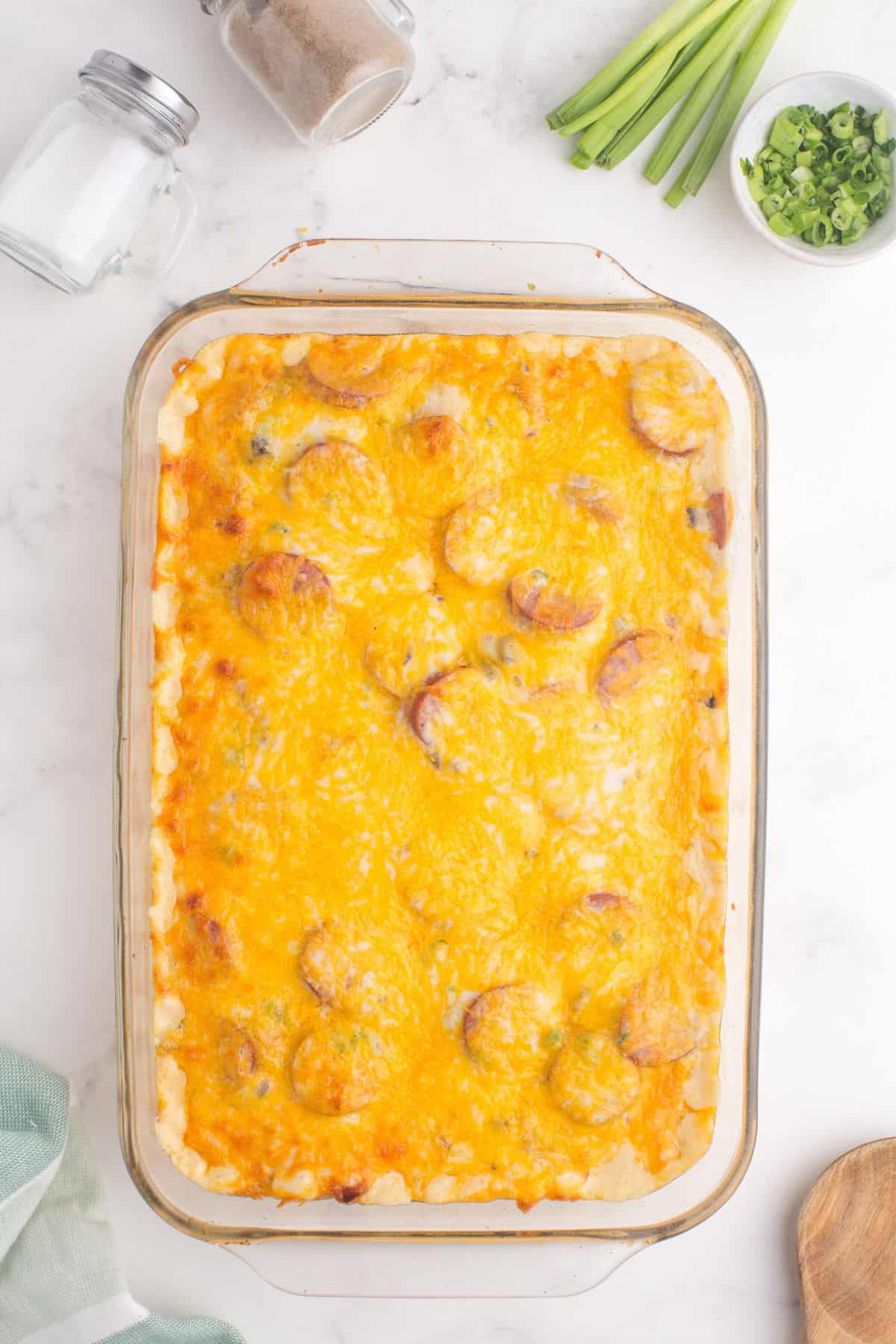 Completed pierogi casserole in a glass baking pan.