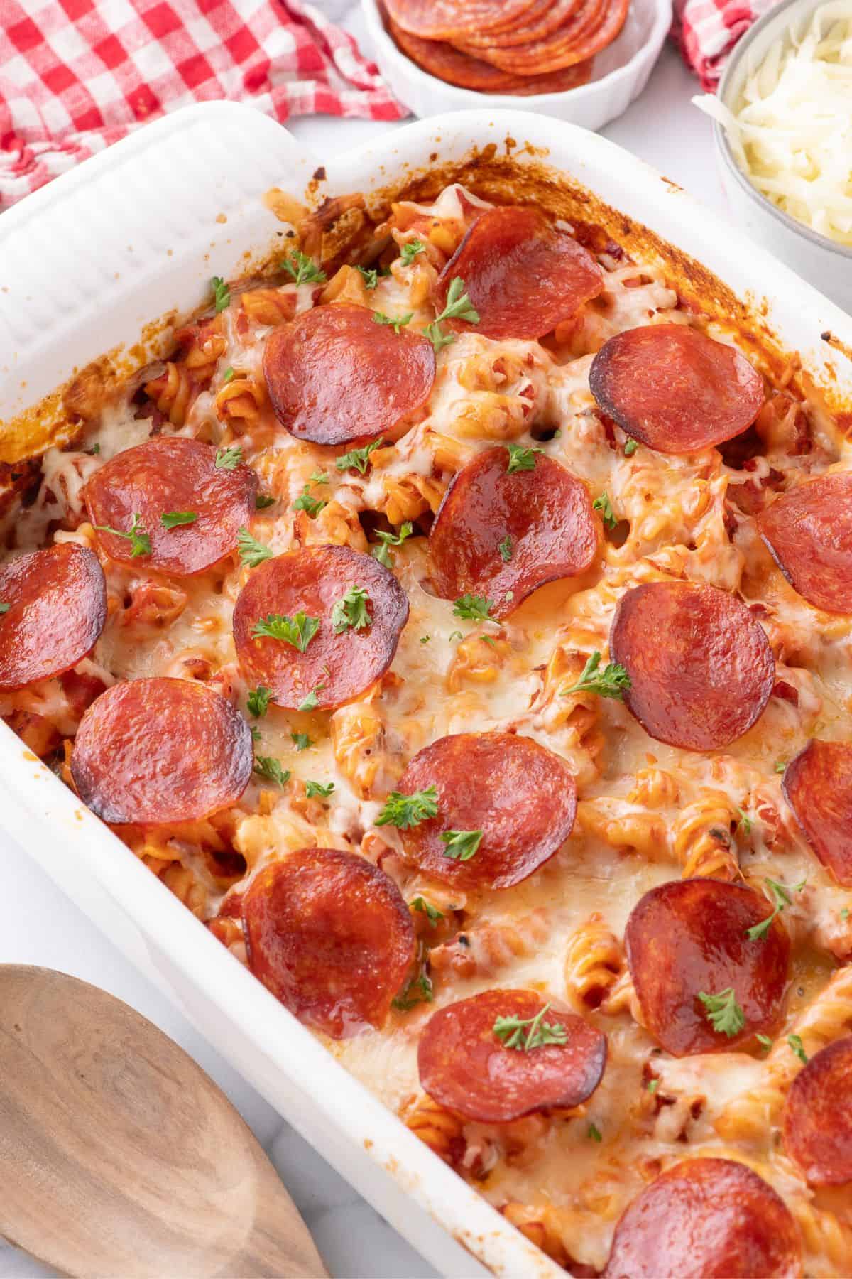 Completed pizza casserole in a white baking dish.