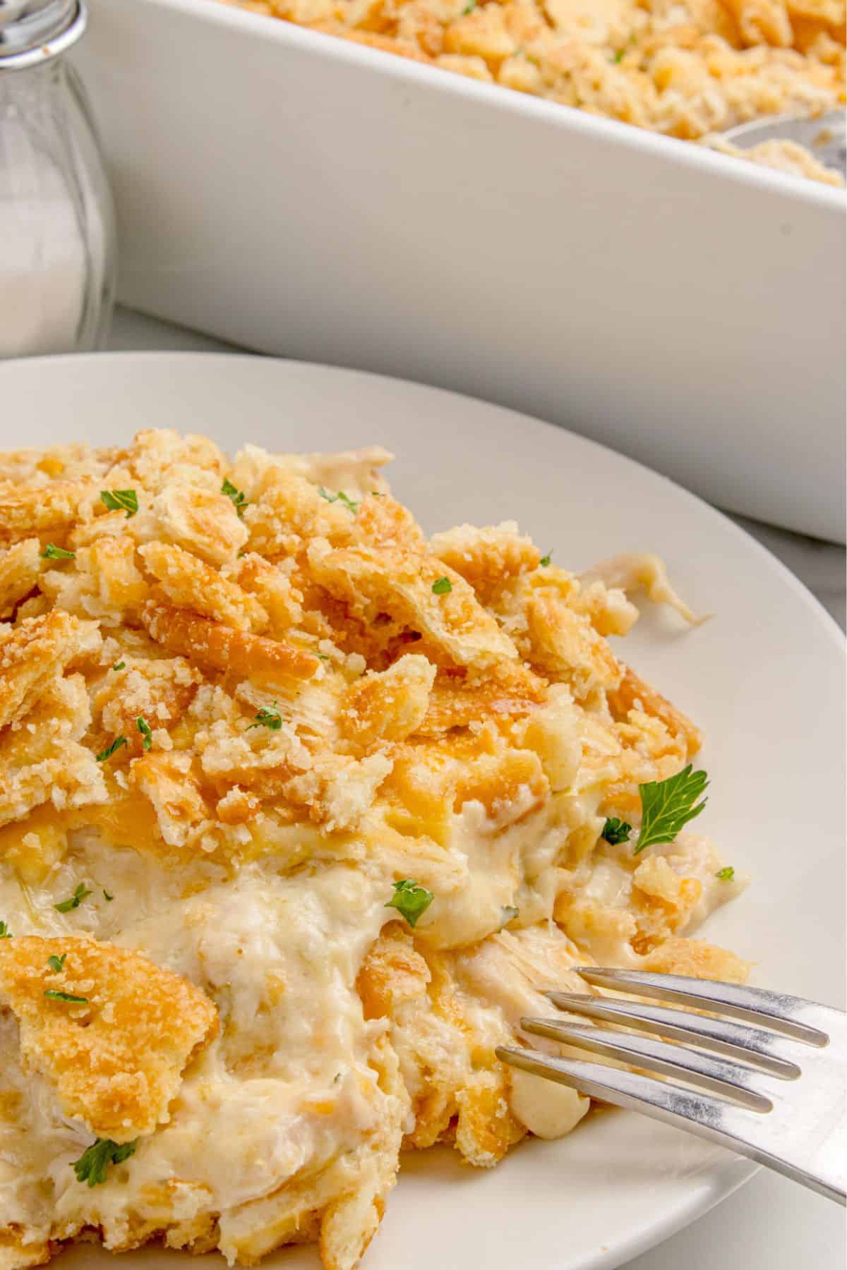 Ingredients for Ritz chicken casserole: rotisserie chicken, cream of chicken soup, cream of celery soup, sour cream, milk, ranch seasoning, cheddar cheese, Ritz crackers, and butter.