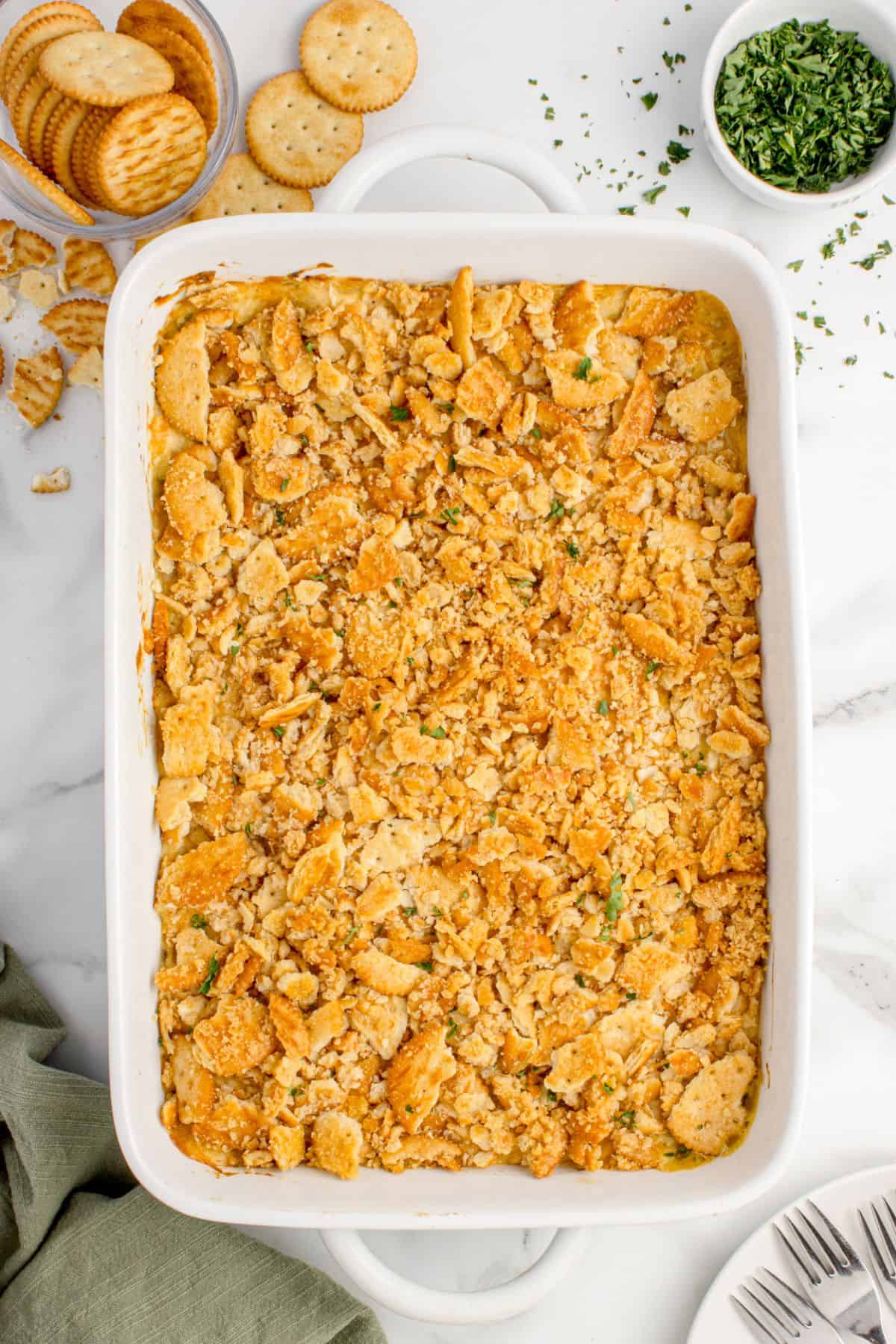 Crushed Ritz crackers have been added to the top of the casserole.