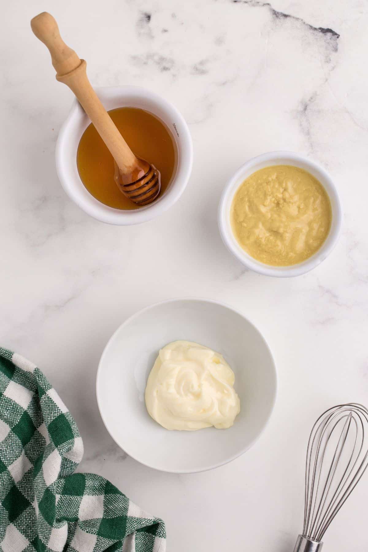 Ingredients for honey mustard: Honey, mayonnaise, and dijon mustard.
