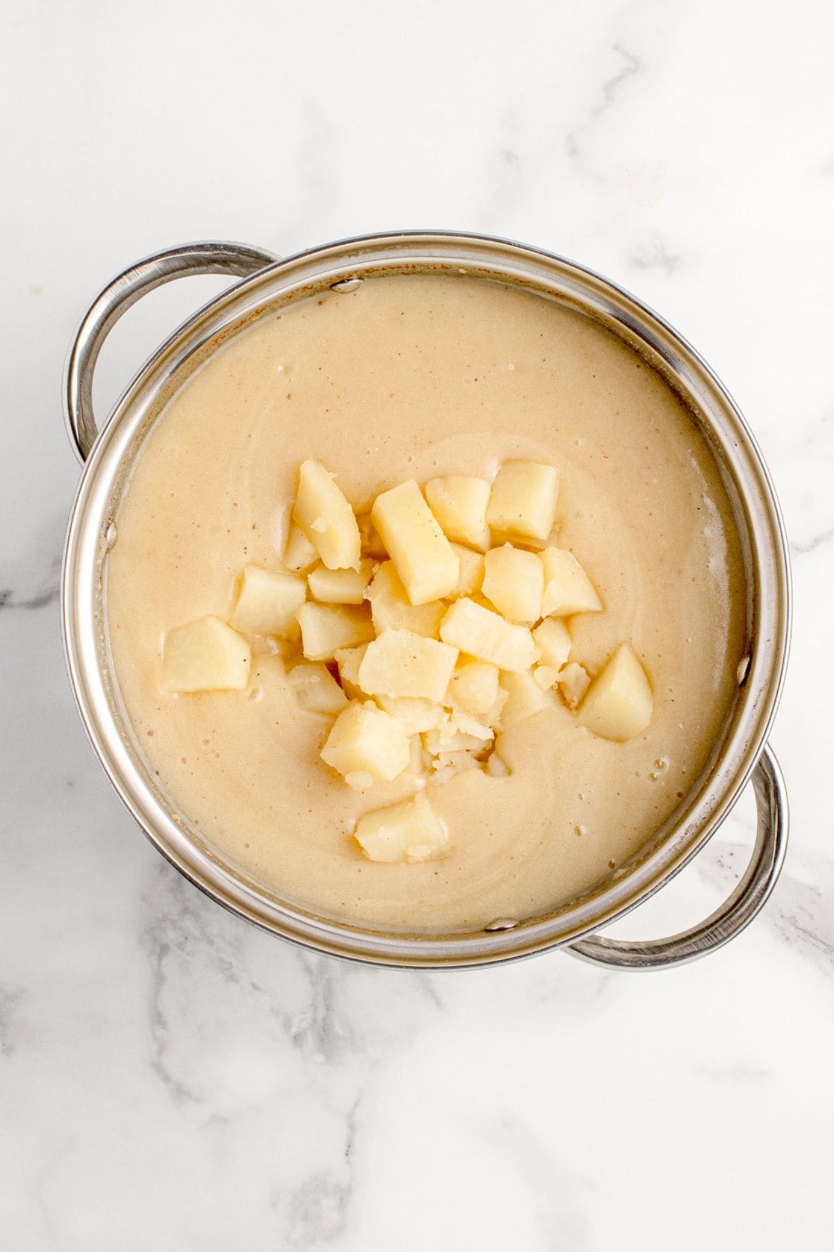 Potato chunks are returned to the soup.
