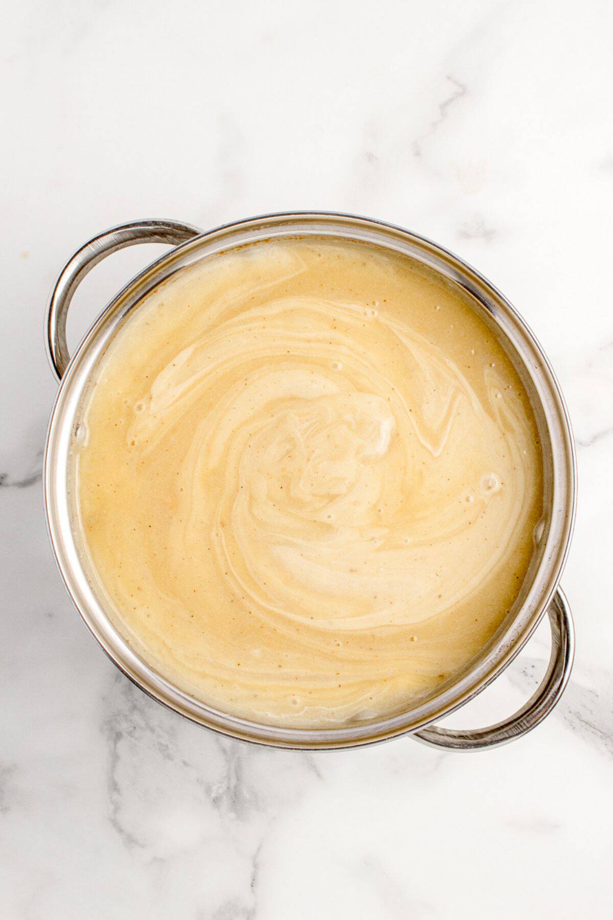 Sour cream is added to the soup.